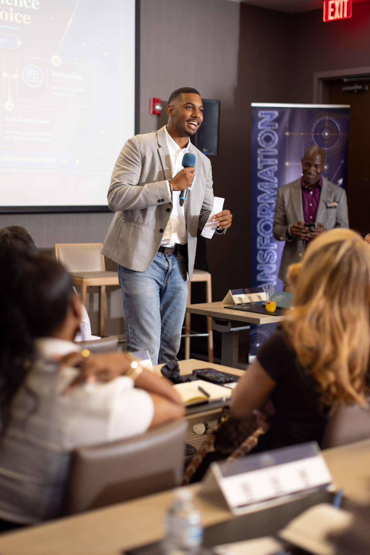 Mohamed, founder of Funemployment, speaking at an event